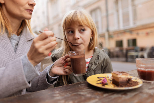istock Joyful Afternoon: Mother and Daughter Sharing Treats Together 2189599403