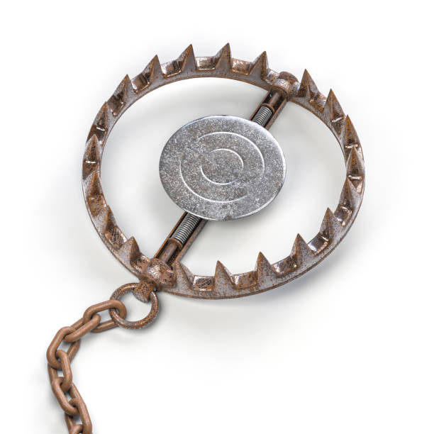 Rusty bear trap with metal bait waiting on white background