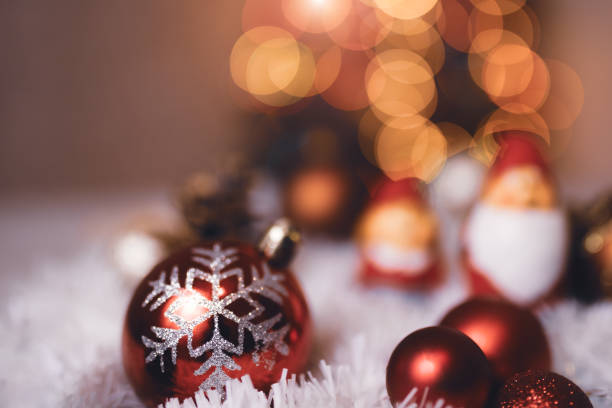 istock Festive Christmas Decorations Featuring Santa Figures and Baubles with Bright Bokeh Lights 2189602492