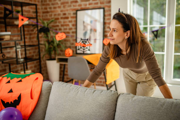 istock Woman preparing Halloween decorations in a cozy home setting 2189603475
