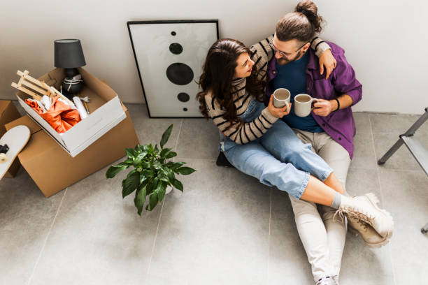 istock Couple drinking first coffee at their new home 2189605492