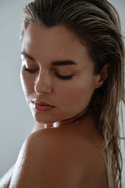 istock Woman with Wet Skin in Relaxed Pose 2189605766