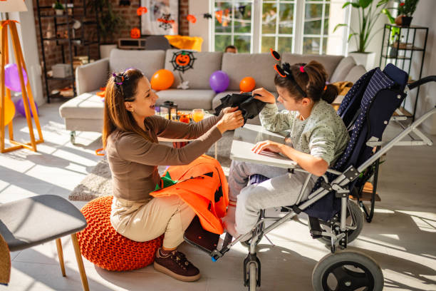 istock Mother and daughter preparing Halloween decorations together in a festive home setting 2189605945