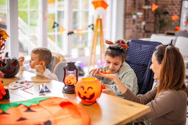 istock Family preparing Halloween decorations together with festive joy and creative activities 2189606004