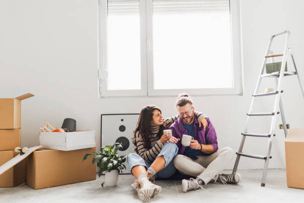 istock Couple drinking first coffee at their new home 2189607003