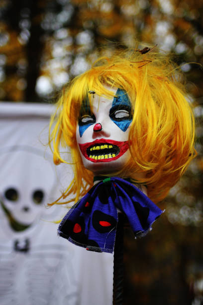 istock Halloween decorations: a clown zombie head on a spike 2189609110