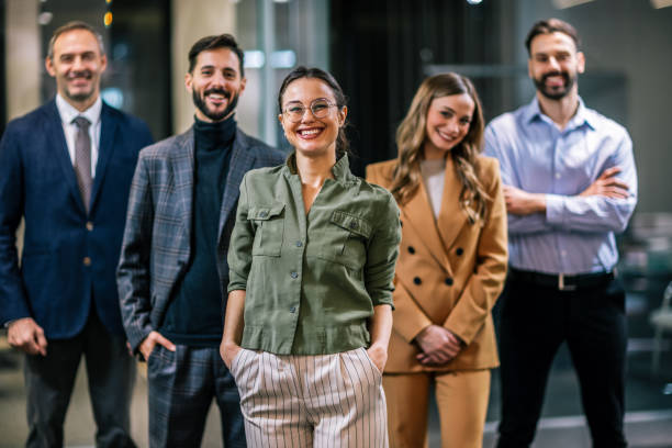istock Diverse team of professionals posing together in a modern coworking office environment. 2189610069