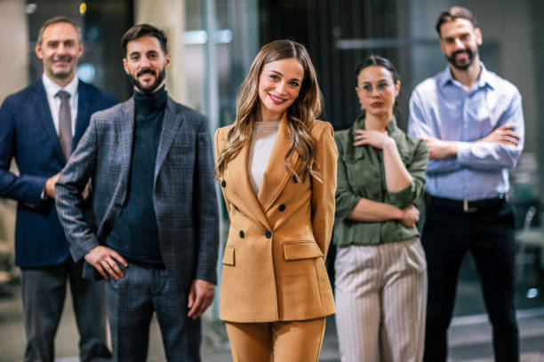 istock Diverse team of professionals posing together in a modern coworking office environment. 2189610185