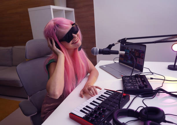 istock Beautiful young singer and musician broadcast from her home studio 2189610978