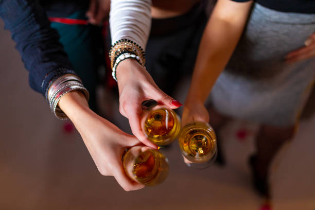 istock Group Toasting with Champagne Glasses in a Celebration Party Setting 2189613348