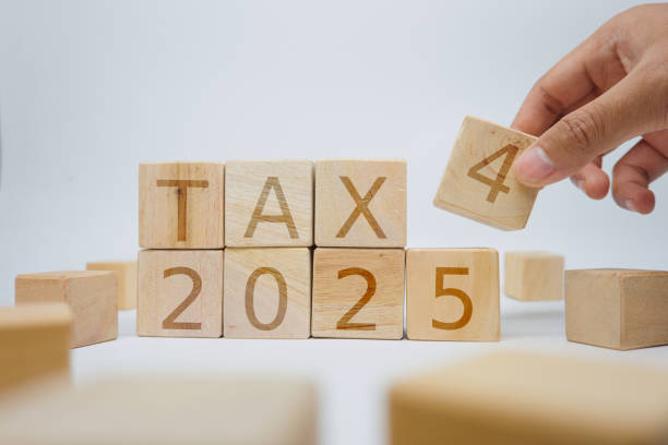 istock Wooden Blocks Displaying Tax 2025 With A Hand Interacting 2189613516