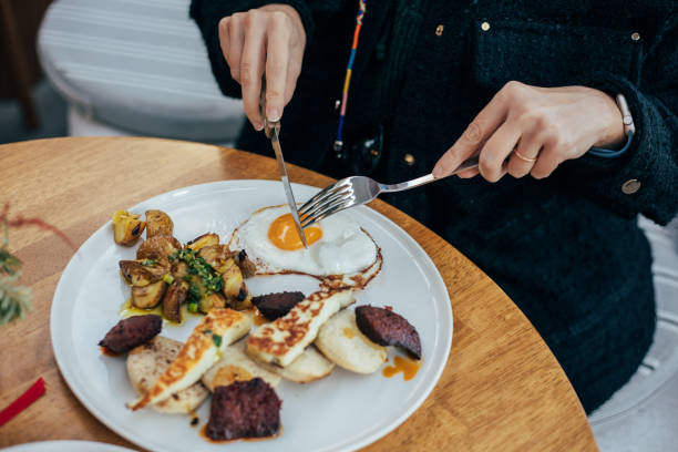 istock Delicious sunny side up fried egg  served with mini breads, halloumi cheese and soudjouk 2189614749