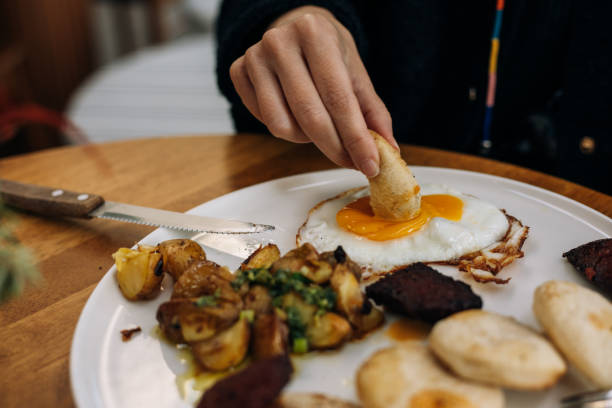 istock Delicious sunny side up fried egg  served with mini breads, halloumi cheese and soudjouk 2189614990