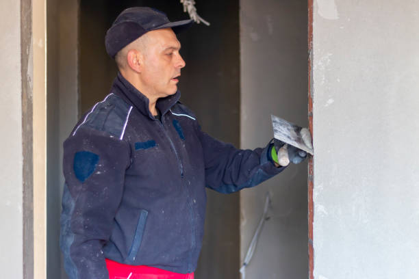 istock A master plastering a walls. The process of applying plaster on the wall. 2189616148