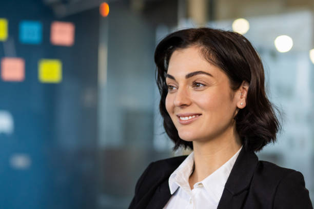 istock Professional business woman smiling confidently in modern office setting 2189616306
