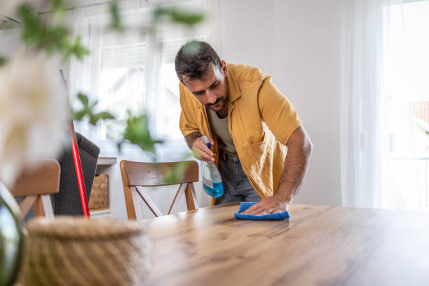 istock Man cleaning surfaces for a fresh start 2189616714