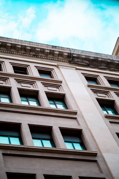 istock Modern Architectural Building Facade Viewed From Below Against a Clear Sky 2189618502