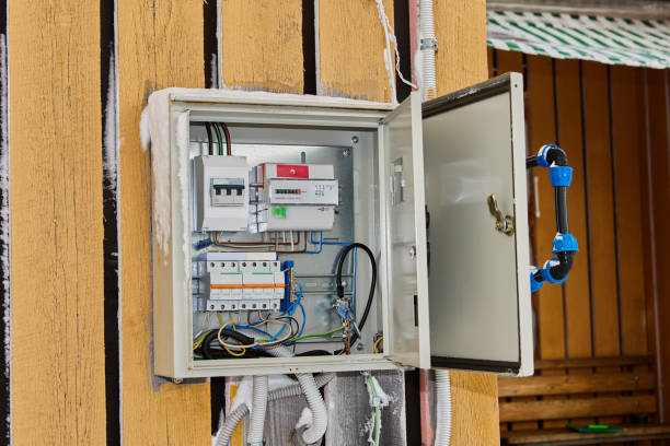 istock External steel electric panel with installed automatic fuses and an electrical meter is wall mounted on rural house facade. 2189631873