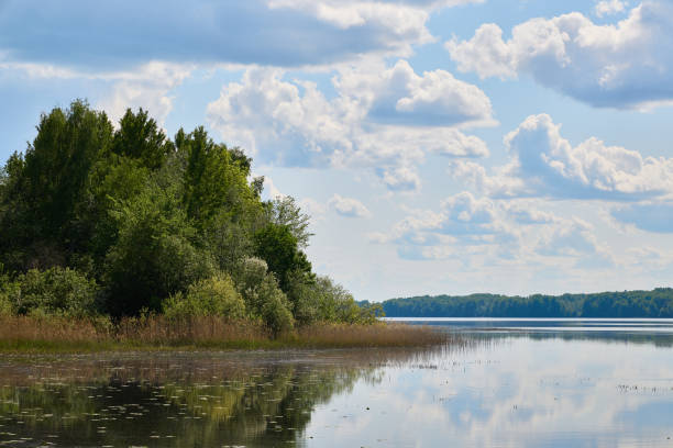istock A serene lake landscape with lush greenery and reflective waters enhancing its beauty 2189632241