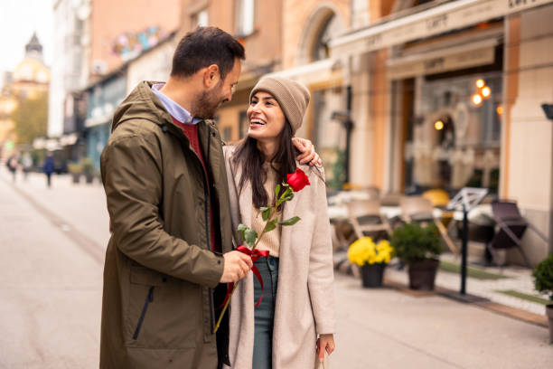 istock Joyful Caucasian Male Surprises Partner with Rose 2189634076