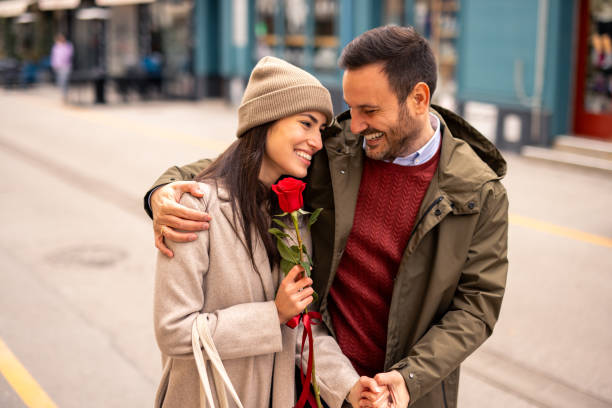 istock Caucasian Male Joyfully Surprises Partner with Romantic Gesture 2189634089