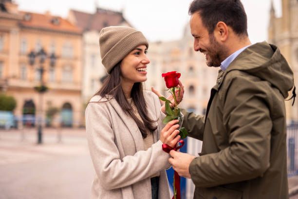 istock Happy Caucasian Couple Celebrating with a Rose 2189634126