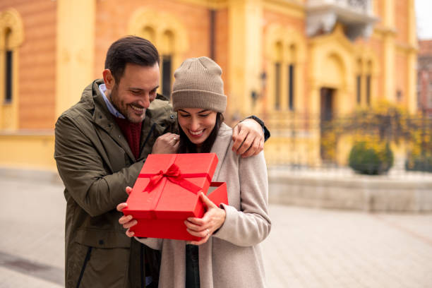 istock Caucasian Couple Joyfully Celebrating Gift Exchange 2189634221