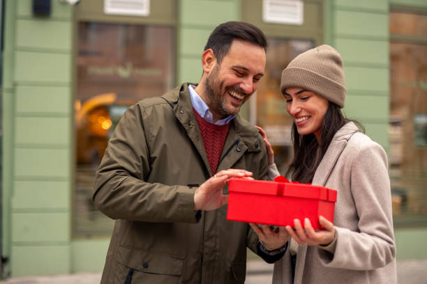 istock Joyful Caucasian Couple Sharing a Surprise Gift 2189634283
