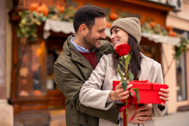 istock Joyful Caucasian Couple Sharing Valentine’s Day Gift Exchange 2189634320