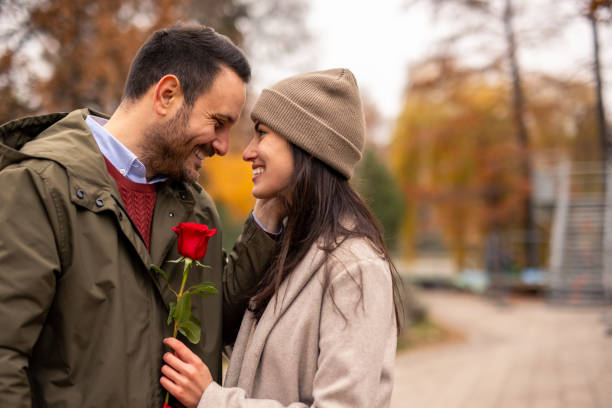istock Cheerful Caucasian Couple Embracing in Park 2189634510