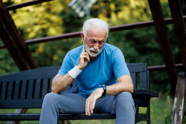 istock Tired senior sporty man resting on park bench 2189637524