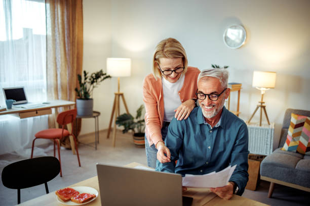 istock Mature woman checking on her working husband at the home 2189640232