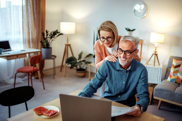 istock Mature woman checking on her working husband at the home 2189640241
