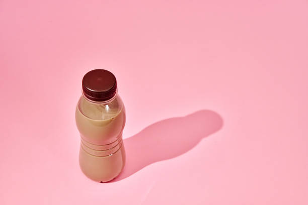 Coffee Latte in Recycled PET Plastic Bottle on Pink Background