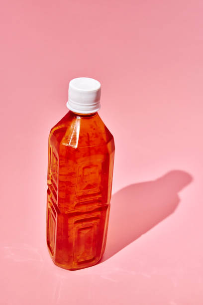 istock Apple Juice in Recycled PET Plastic Bottle on Pink Background 2189641100