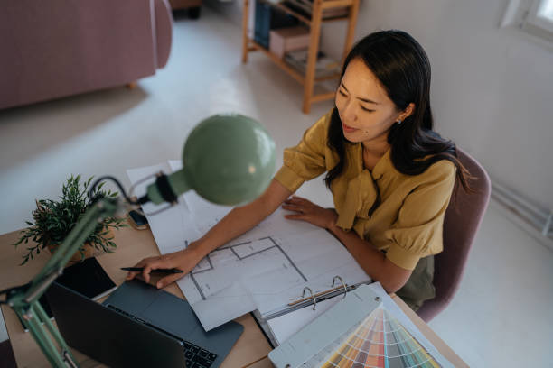 istock Designer Reviewing Color Palettes in a Modern Workspace 2189641511