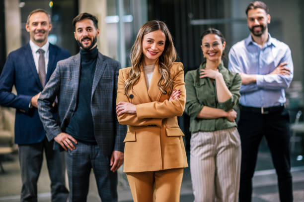 istock Diverse team of professionals posing together in a modern coworking office environment. 2189642533