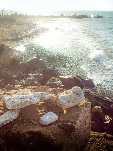 rocks on the sea coast, photo as a background, digital imageDirt road leading to the sea on a sunny summer day.