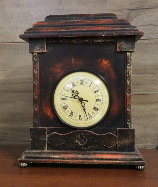 istock An old antique looking wooden clock. 2189643247