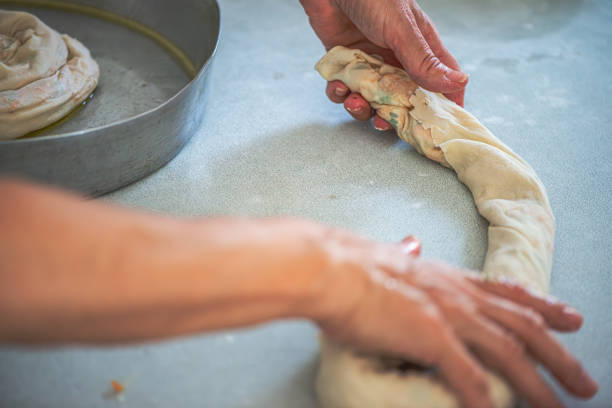 istock Elderly Woman Rolling Out Dough 2189643715