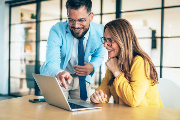istock Two business coworkers talking 2189644043