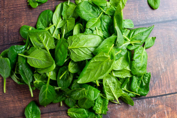 istock Spinach in little bowl on wooden background 2189650825