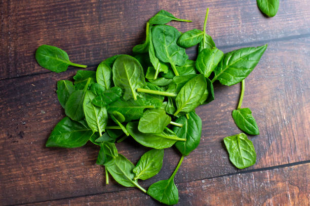istock Spinach in little bowl on wooden background 2189650828