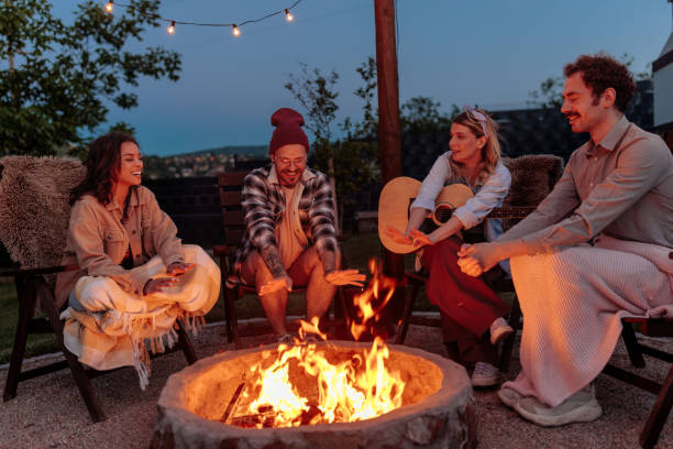 istock Cozy evening by the campfire for four friends 2189650966