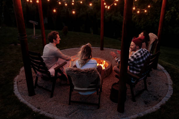 istock Rear view of four people enjoying a campfire 2189650987