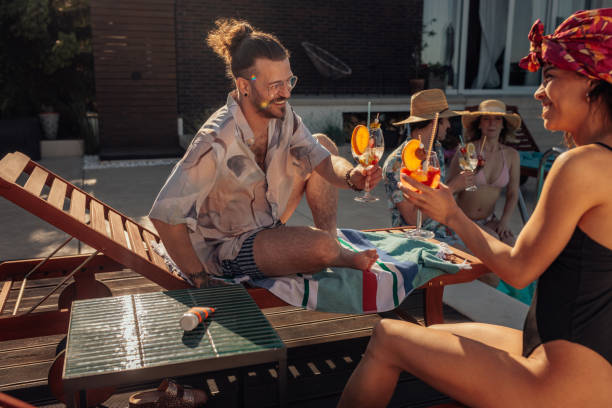 istock People enjoying a poolside summer party 2189650988