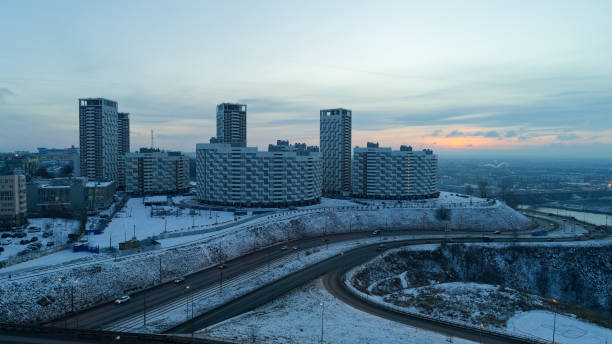 istock Cityscape with a snowy hill and a road 2189654722