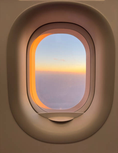 istock A window on an airplane with a beautiful sunset in the background 2189655943