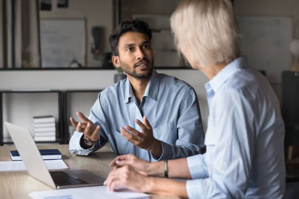 istock Indian agent or broker sell company services to female client 2189657936