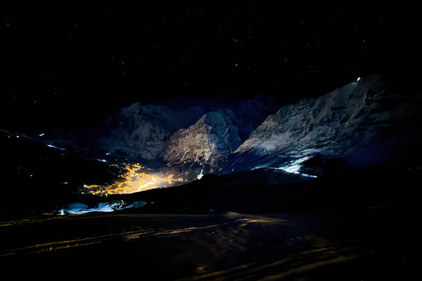 istock Panoramic view of illuminated Grindelwald at night seen from Maennlichen 2189658746